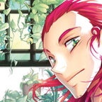 junger Mann mit roten Haaren im Gewächshaus 