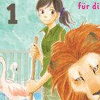 Auf dem Bild ist eine Tierpflegerin mit einem Löwen im Zoo zu sehen.